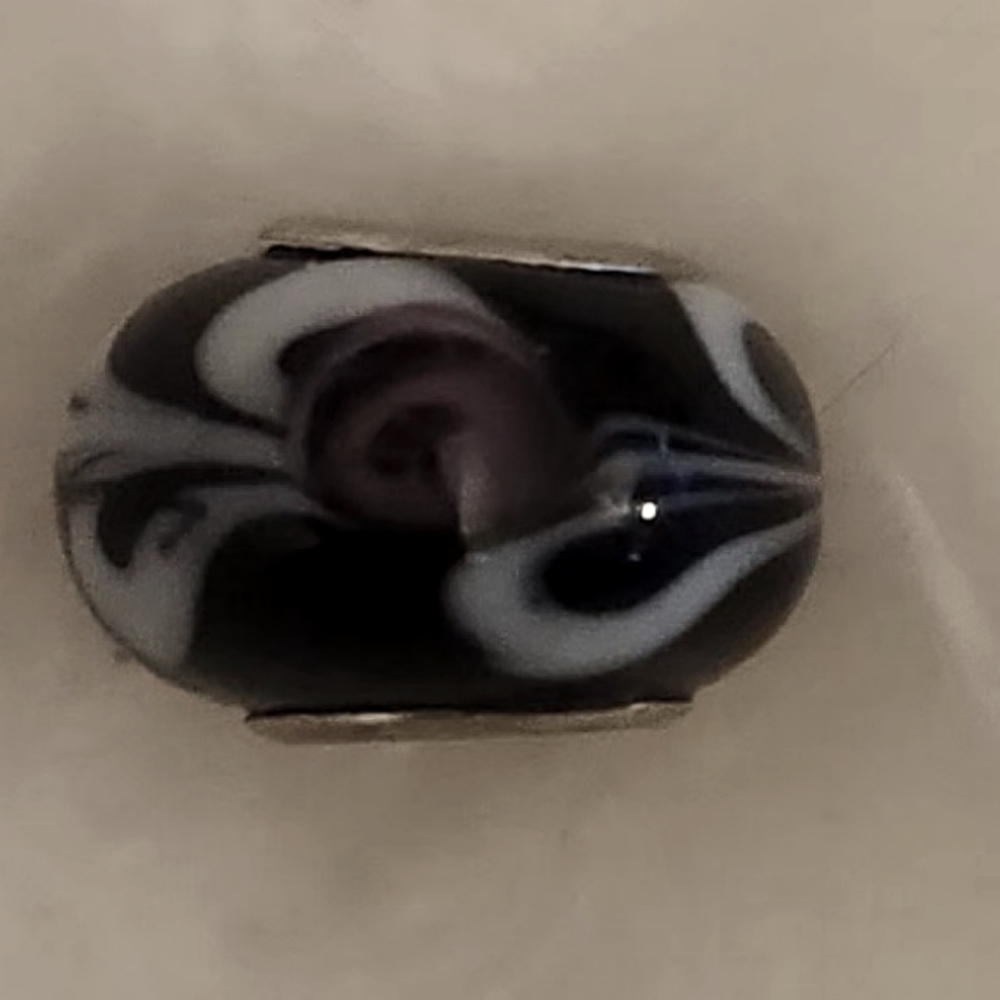 Glass Brighton charm with flower design